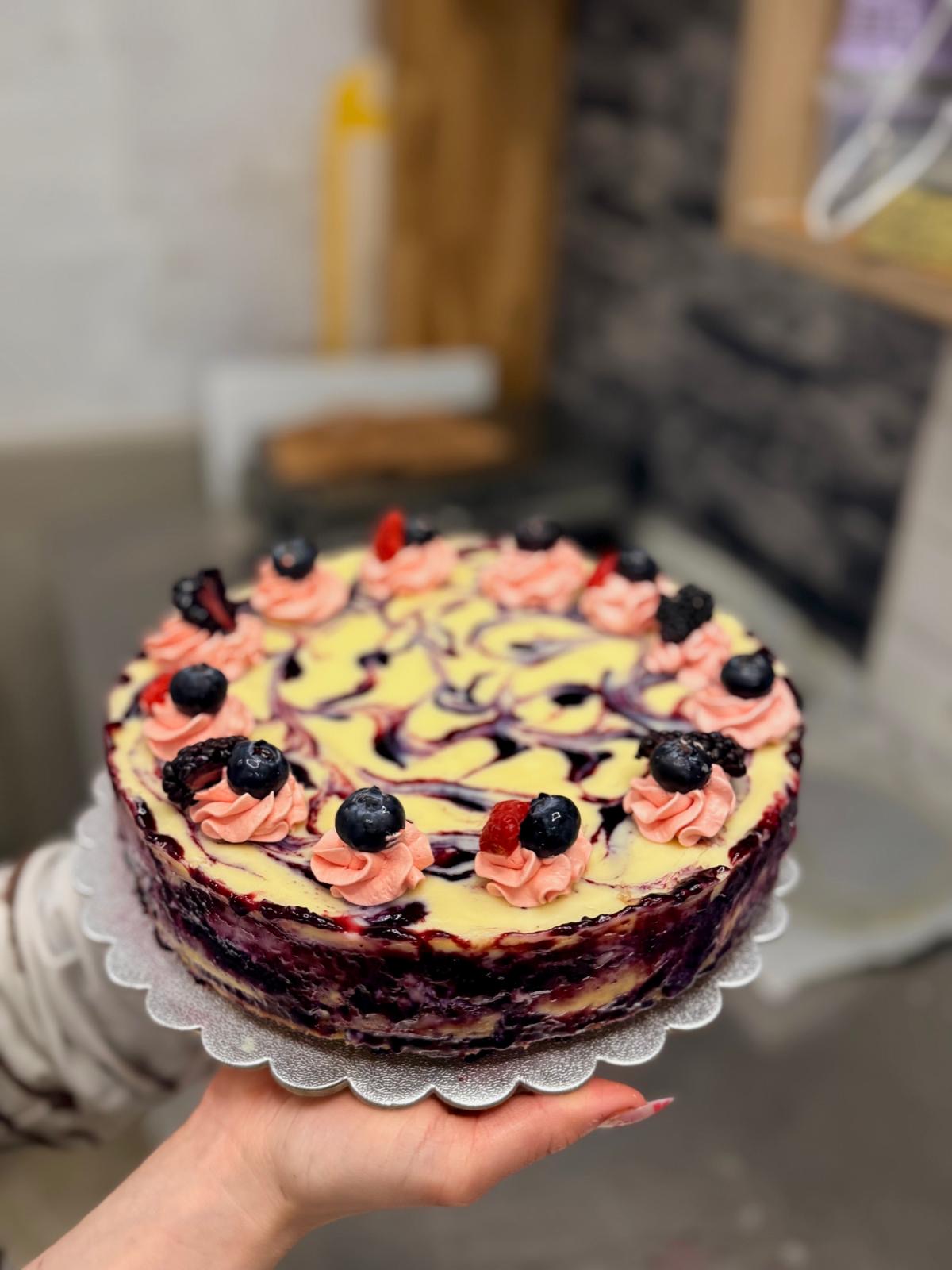 Berry swirl cheesecake finished with fresh fruit
